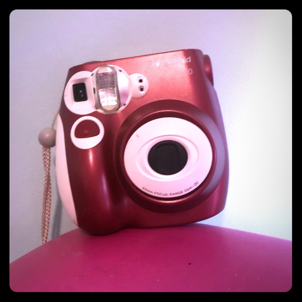 Maroon Polaroid camera